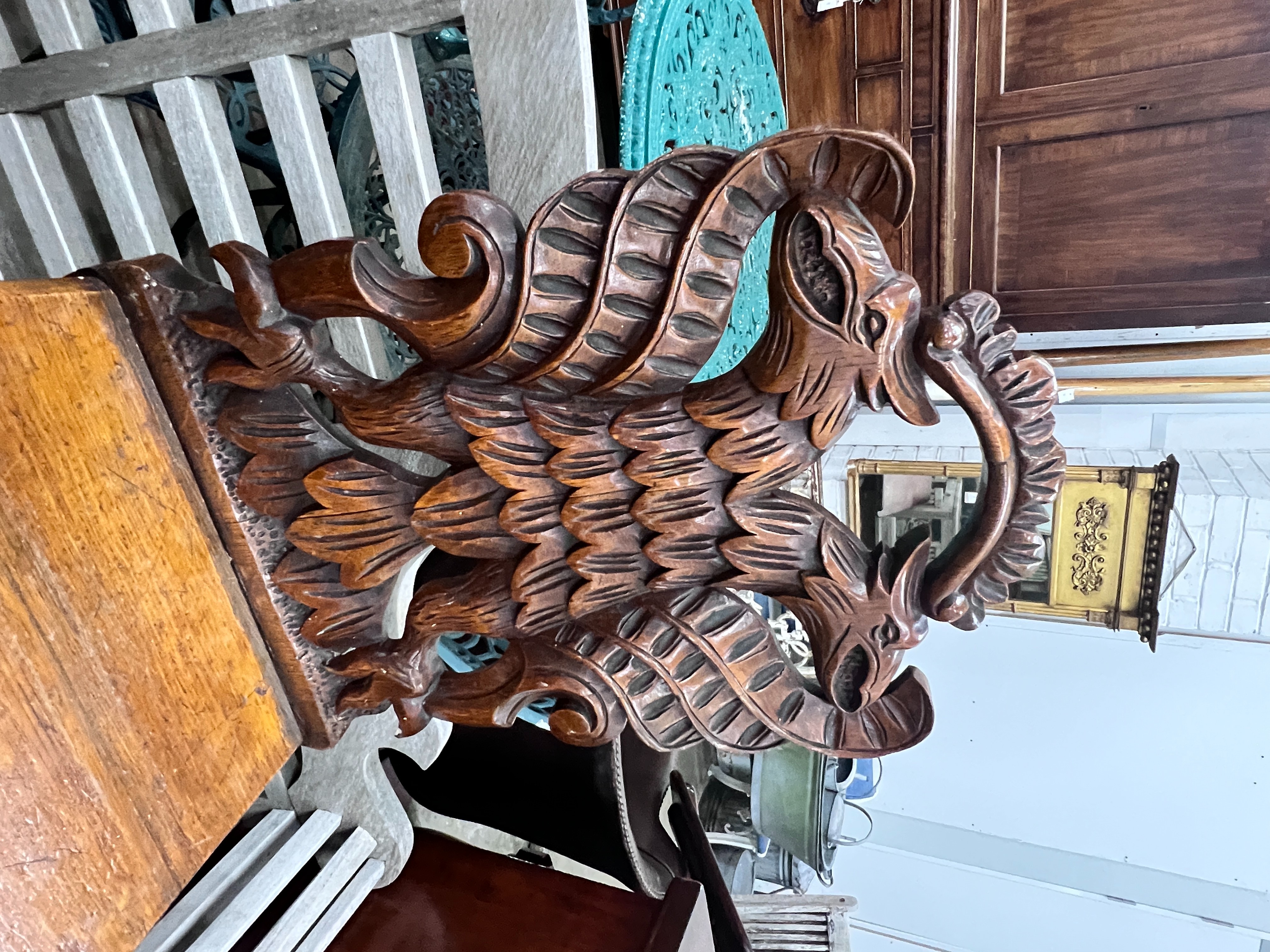 A pair of Victorian carved oak hall chairs with carved twin eagle backs, width 44cm, depth 40cm, height 90cm